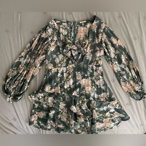 New Floral Romper with ruffle skirt & tie front! Brand: Luxxel Size: Large